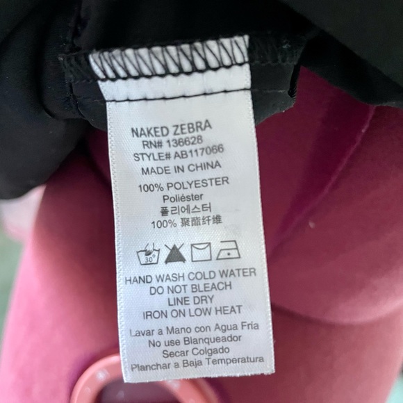 Naked Zebra - classy black top with shoulder pads, back slit and back zip - Picture 9 of 10